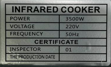 Back view of an infrared cooker with a label displaying specifications.