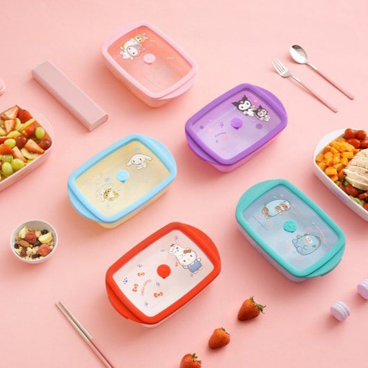 Set of colorful lunch containers with food on a pink background