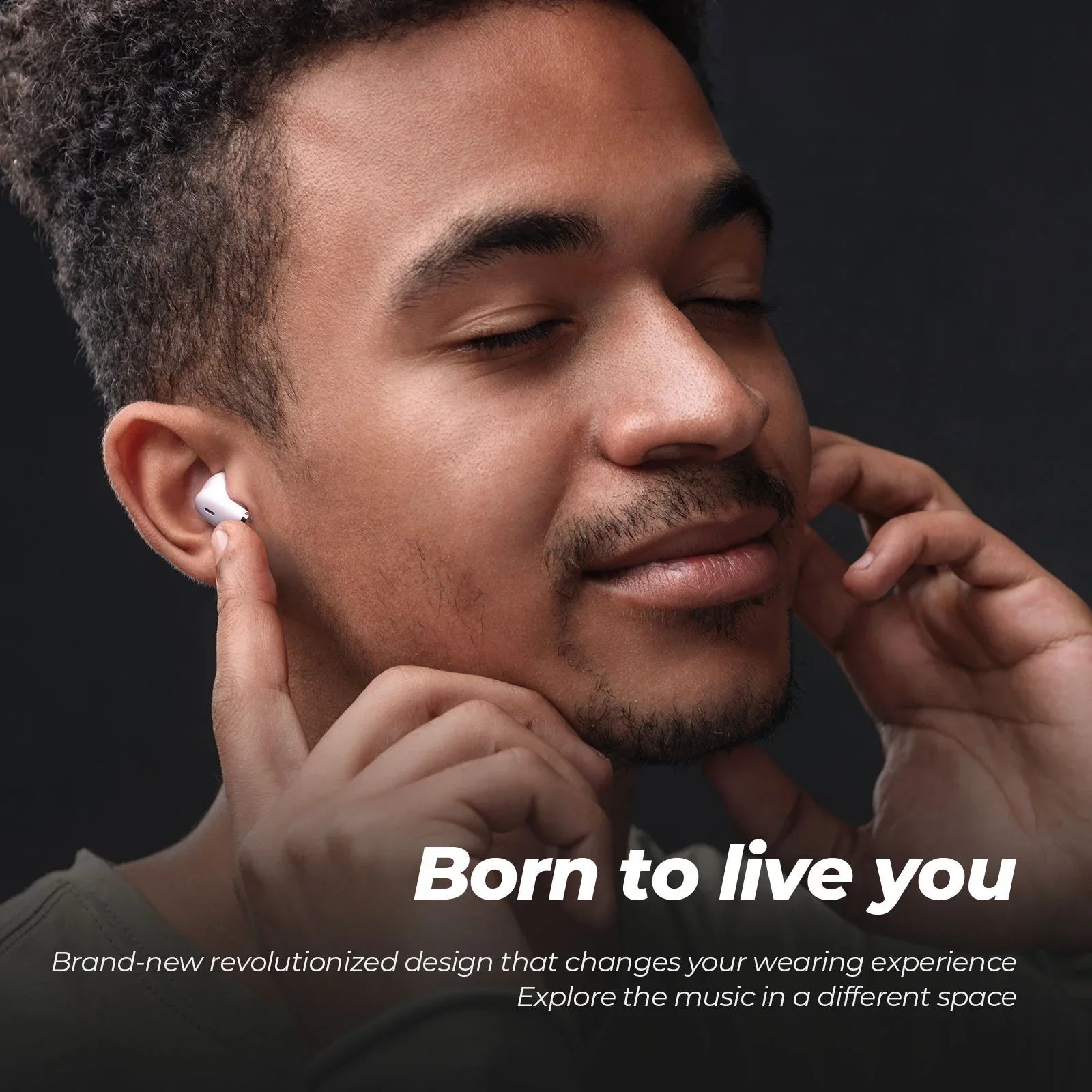 Man wearing wireless earbuds with text 'Born to live you' on a dark background